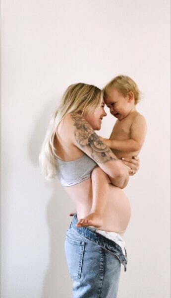 Pregnant Chloe Holding Her son